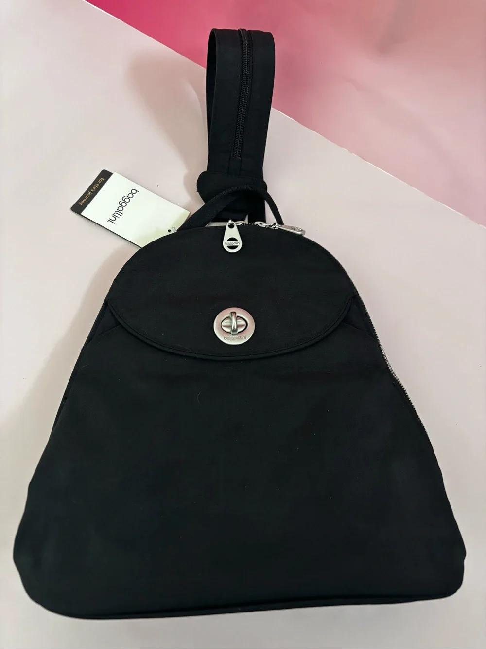 Baggallini Black Sling Cairo Backpack with Turn-Lock Detail-
